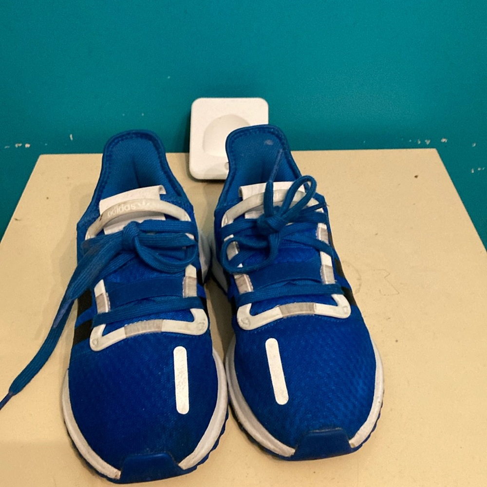 A pair of adidas youth size 5